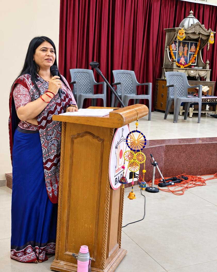 Leena ben Kaushalkumar Patel addressing community gathering